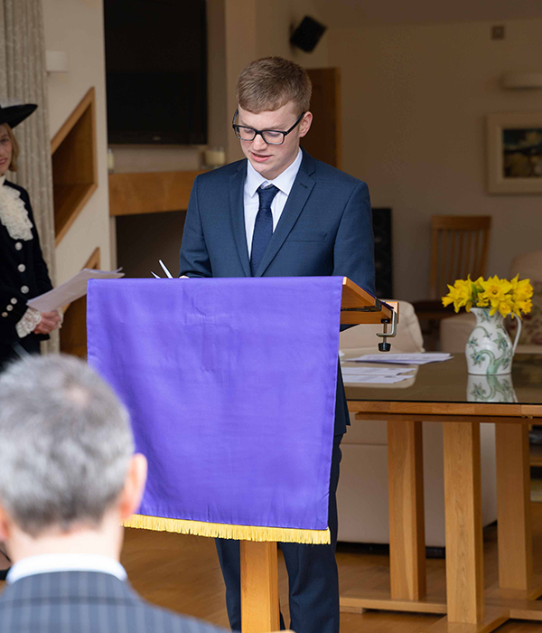 John Barton reading the installation of High Sheriff of Cumbria