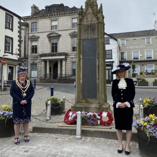 High Sheriff Julie Barton lays flowers at Market Cross VE Day