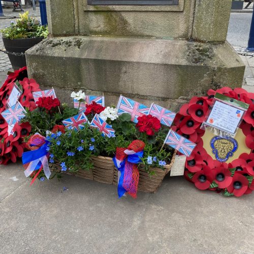 VE Day flowers and wreath at Ulverston Market Cross