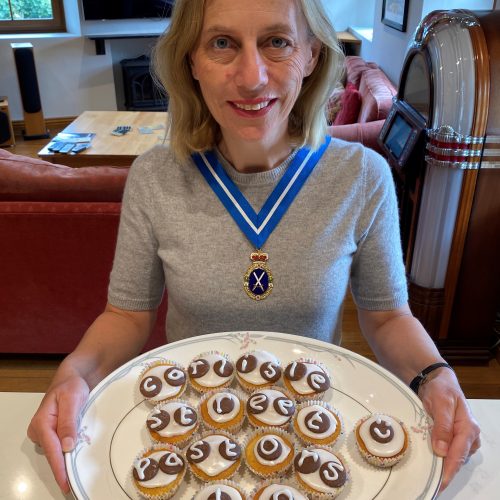 Julie with cakes she has baked